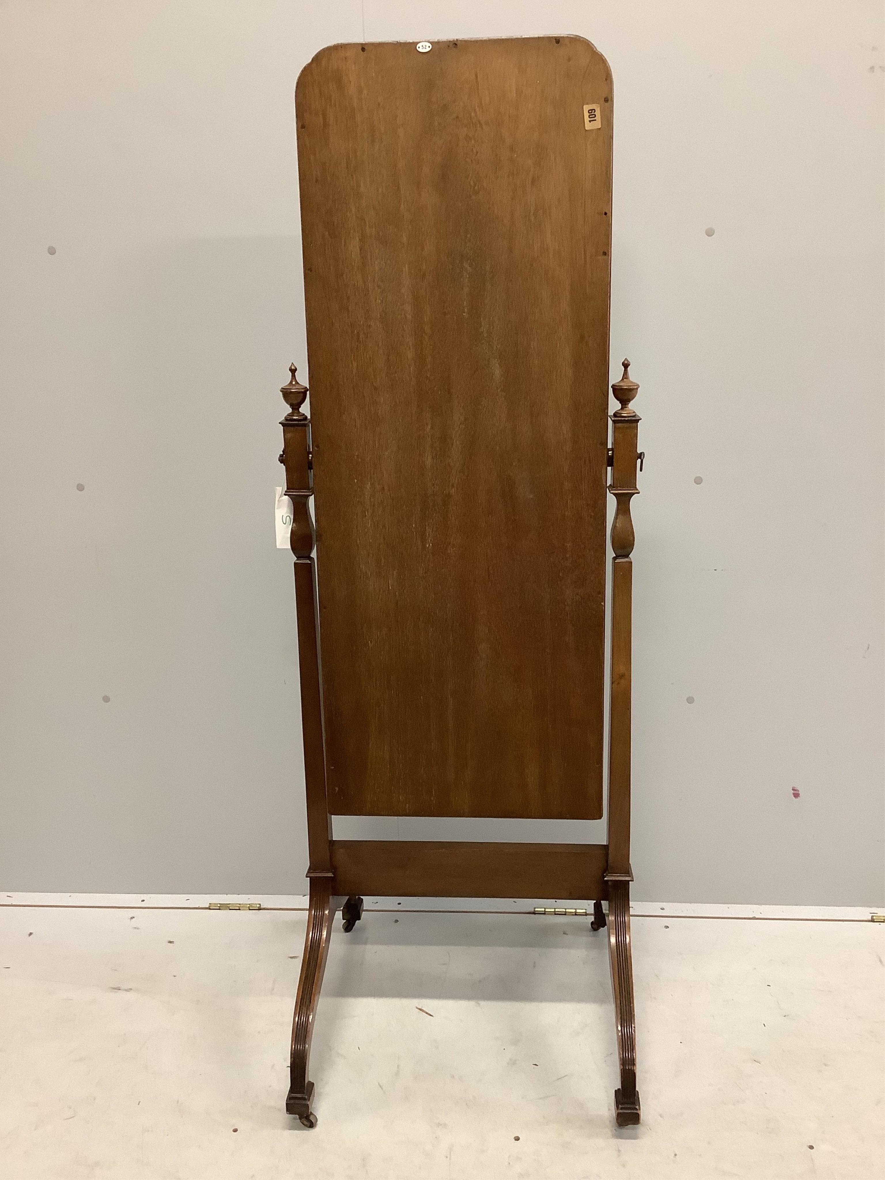 An early 20th century mahogany cheval mirror on fluted down swept feet, width 54cm, height 158cm. Condition - fair to good